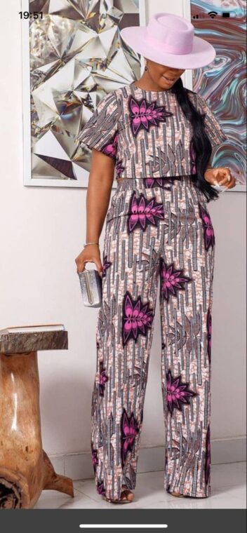 An Ankara print blouse with high-waisted black pants