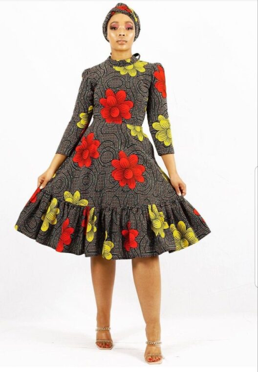 An Ankara print midi-dress with a high neck and long sleeves