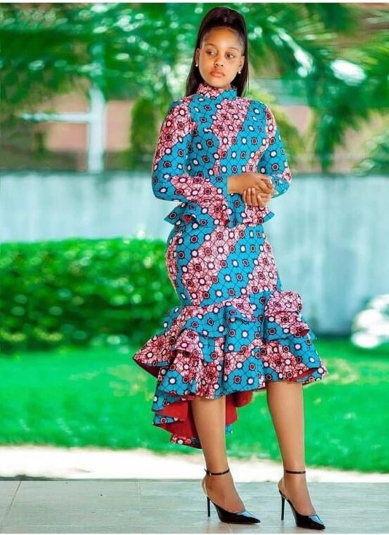A midi-length Ankara dress with a ruffled hem and long sleeves