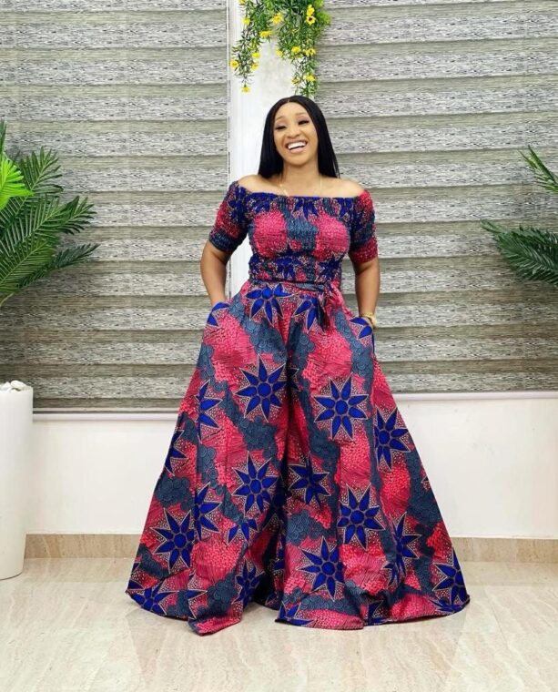 An Ankara jumpsuit with a fitted waist and wide-leg pants