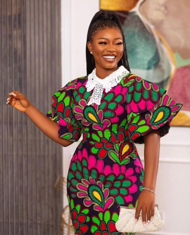 A fitted Ankara dress with a wrap-around neckline