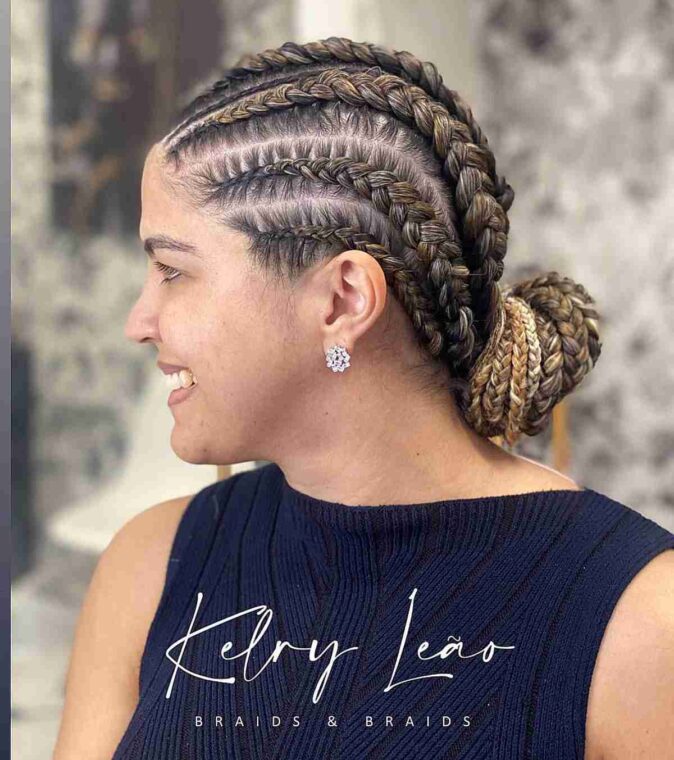 Highlighted ghana braids with a low bun